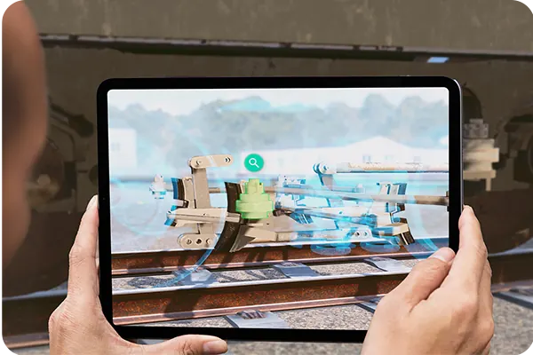 Augmented reality on a tablet beside rail equipment