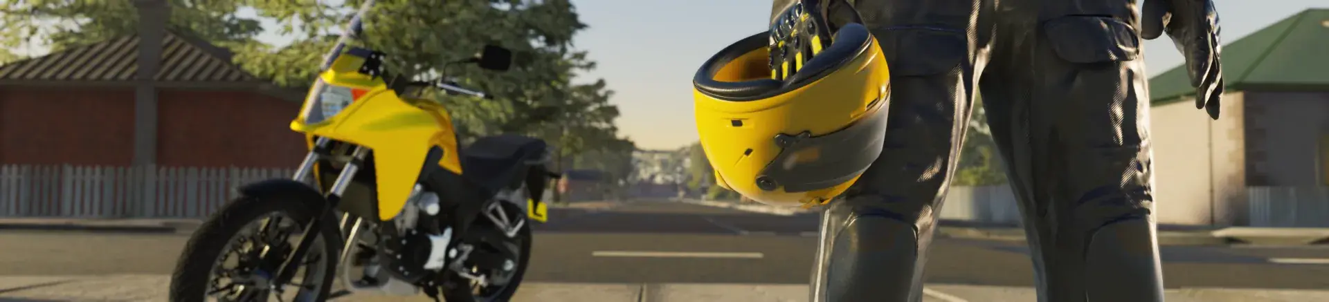 A learner rider with helmet in hand beside a motorbike